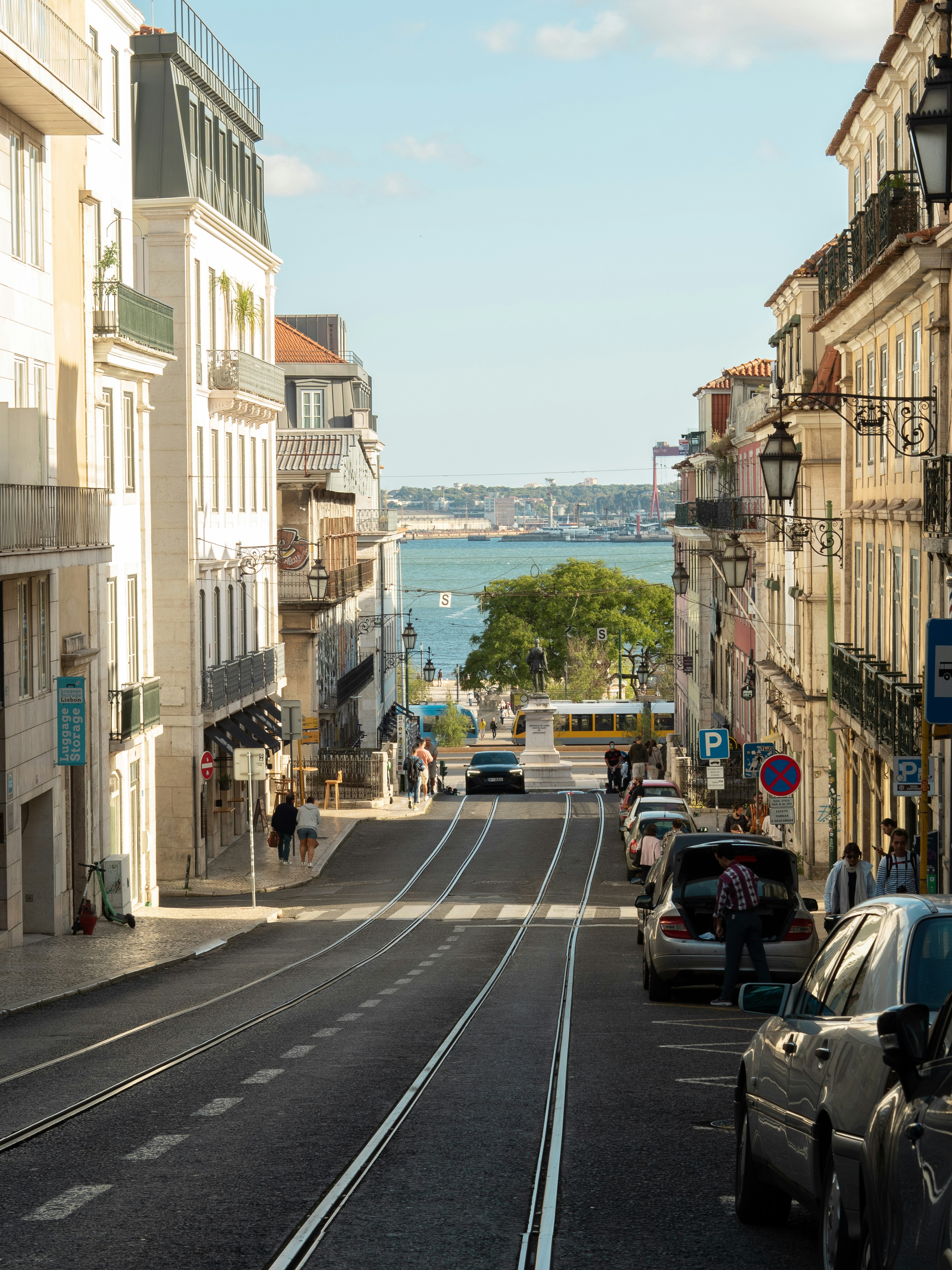 cars parked on side of the road during daytime