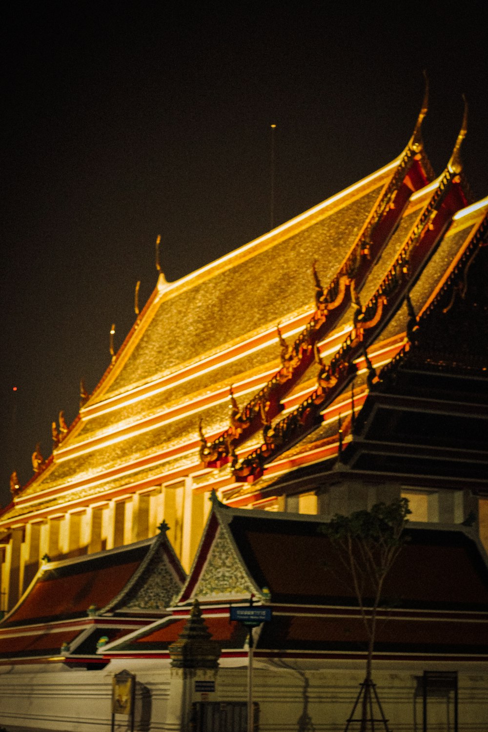 gold and black temple during night time
