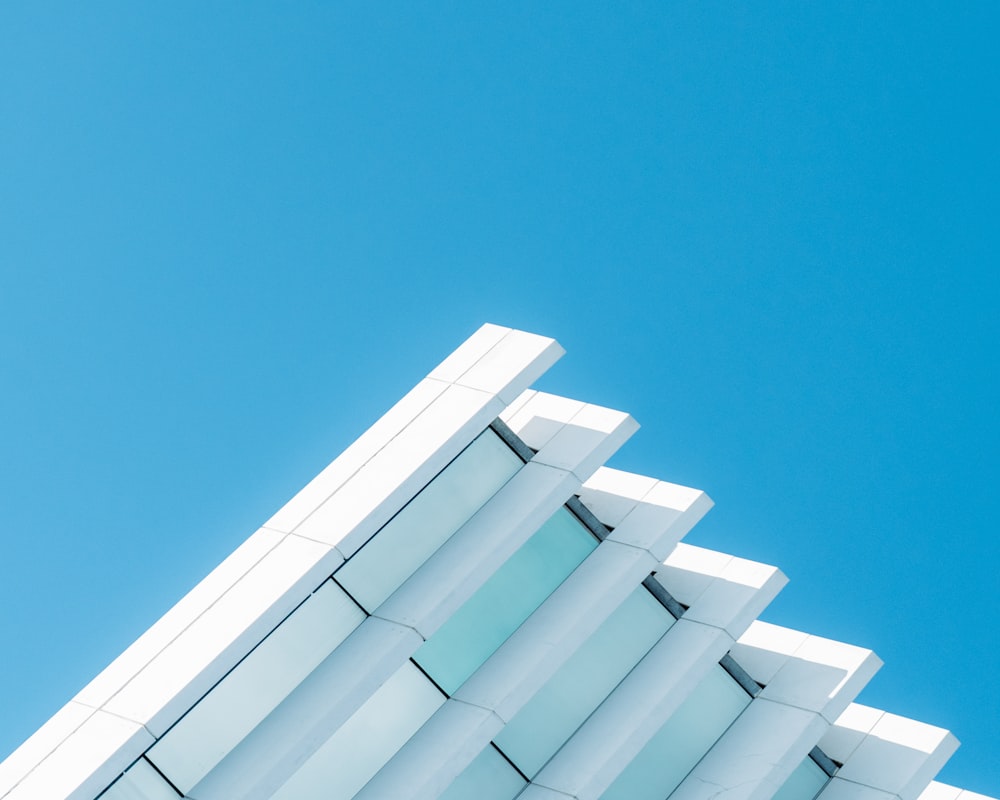 white concrete building under blue sky during daytime