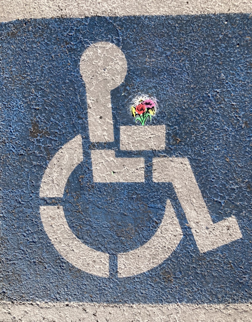 disability parking sign painted on the ground designed to show how to get more rights through strategic self-advocacy training.