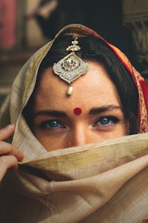 woman wearing gold crown and gold crown