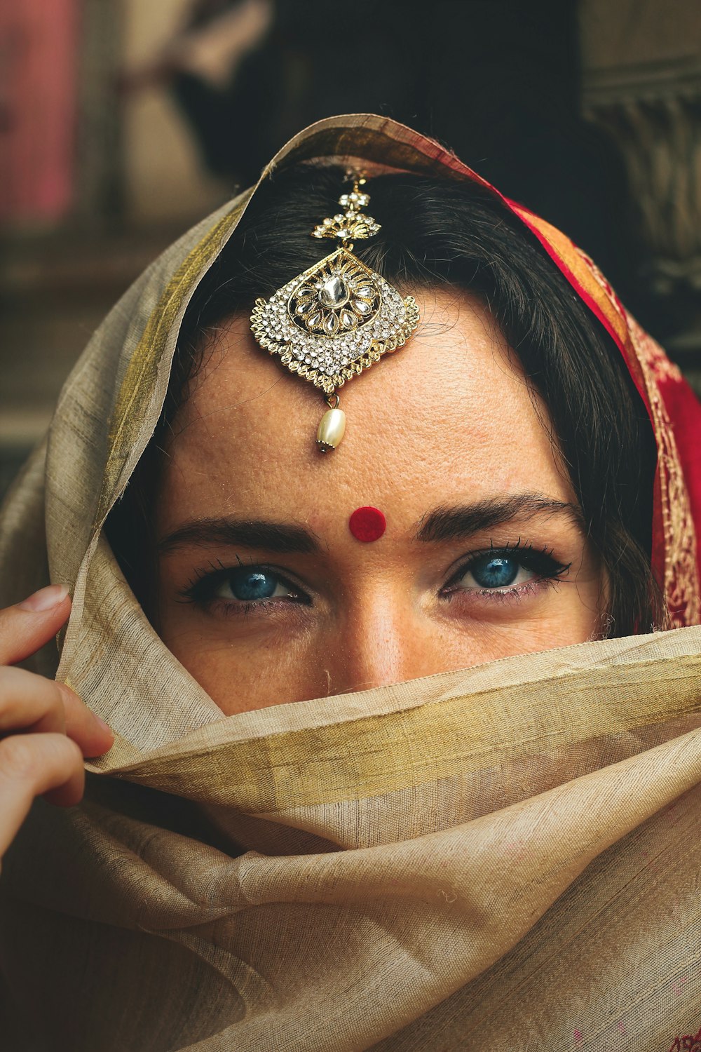 woman wearing gold crown and gold crown