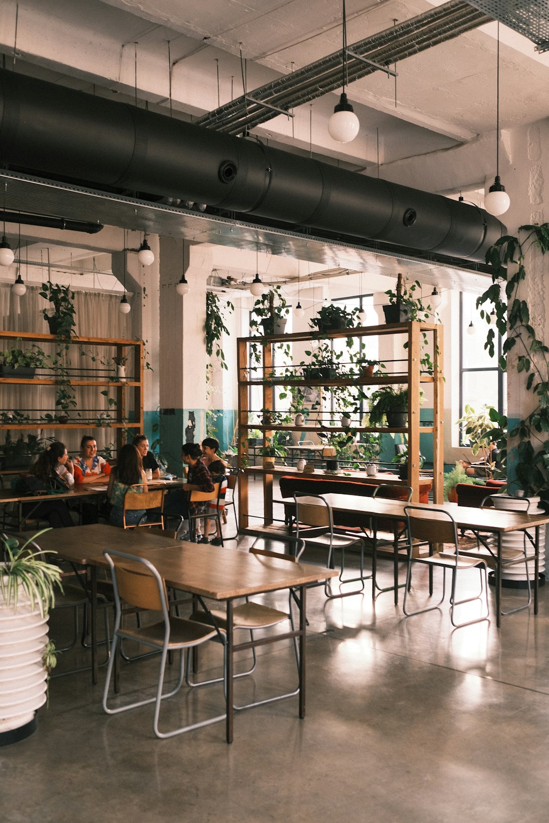 people sitting on chairs inside restaurant