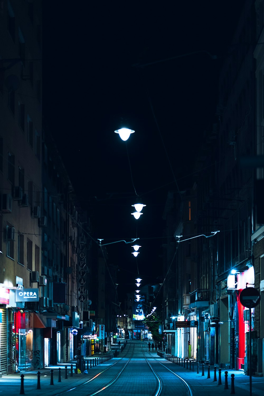 cars parked on the side of the road during night time