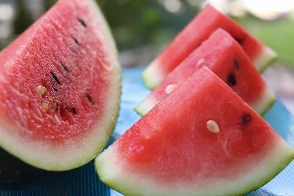 sliced watermelon on white table