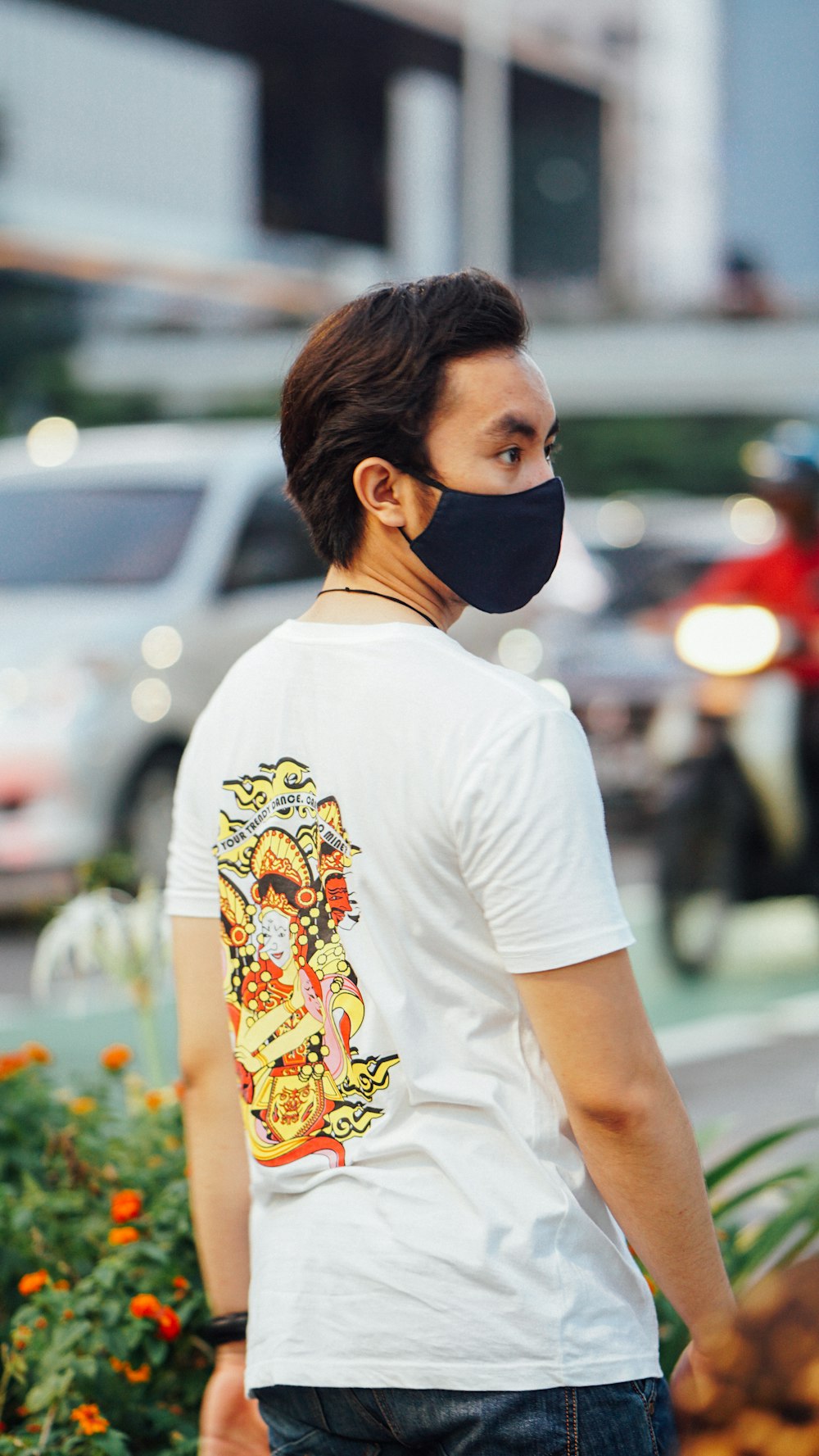 woman in white crew neck t-shirt wearing white and black mask