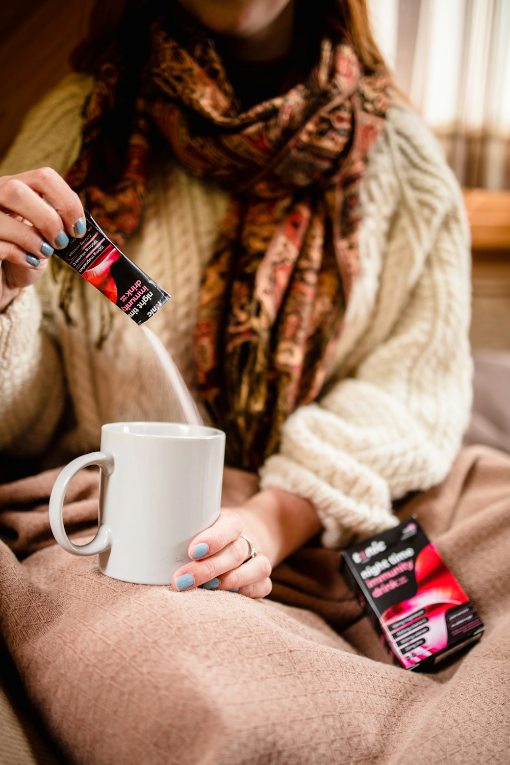 person holding a black and red pack