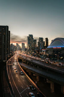 A sunny day view of the Toyota Matrix driving past Toronto landmarks, capturing the city vibe.