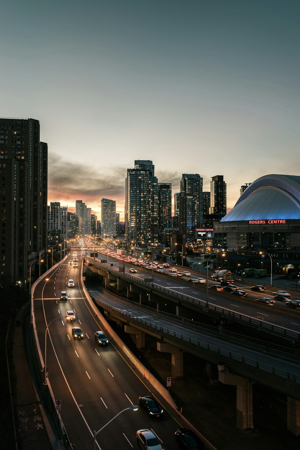 city buildings and road during night time