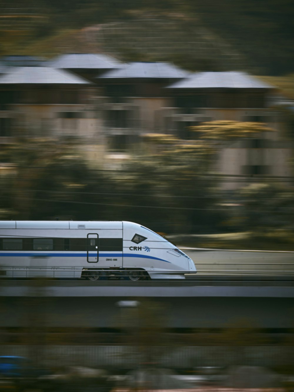 white and blue train on track during night time