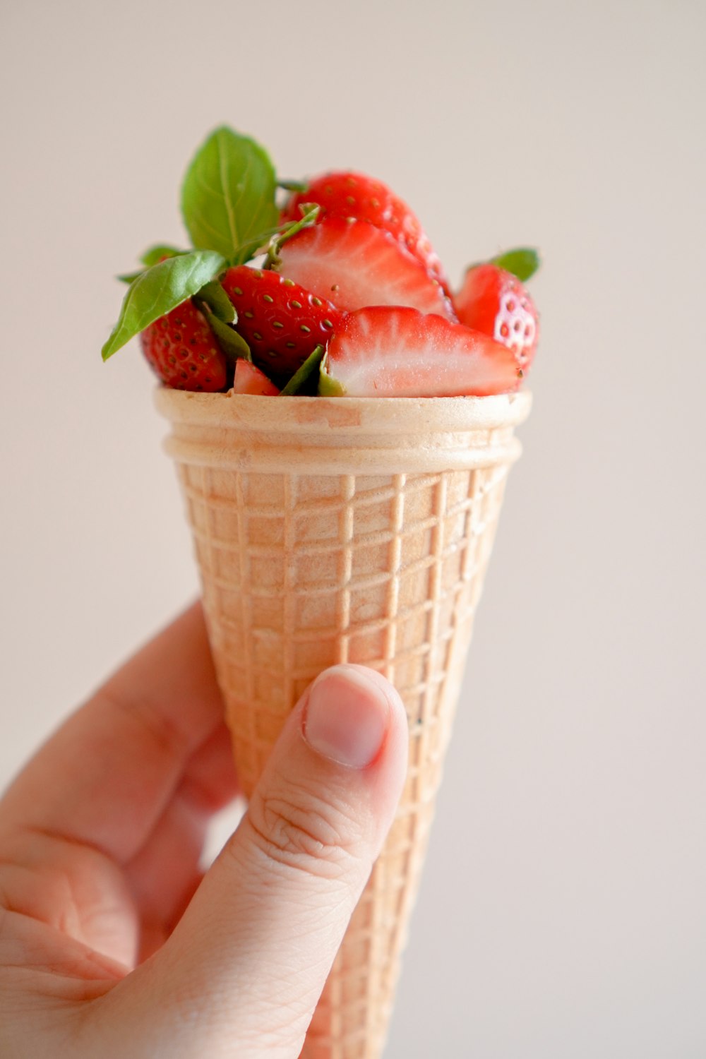 strawberry ice cream in cone