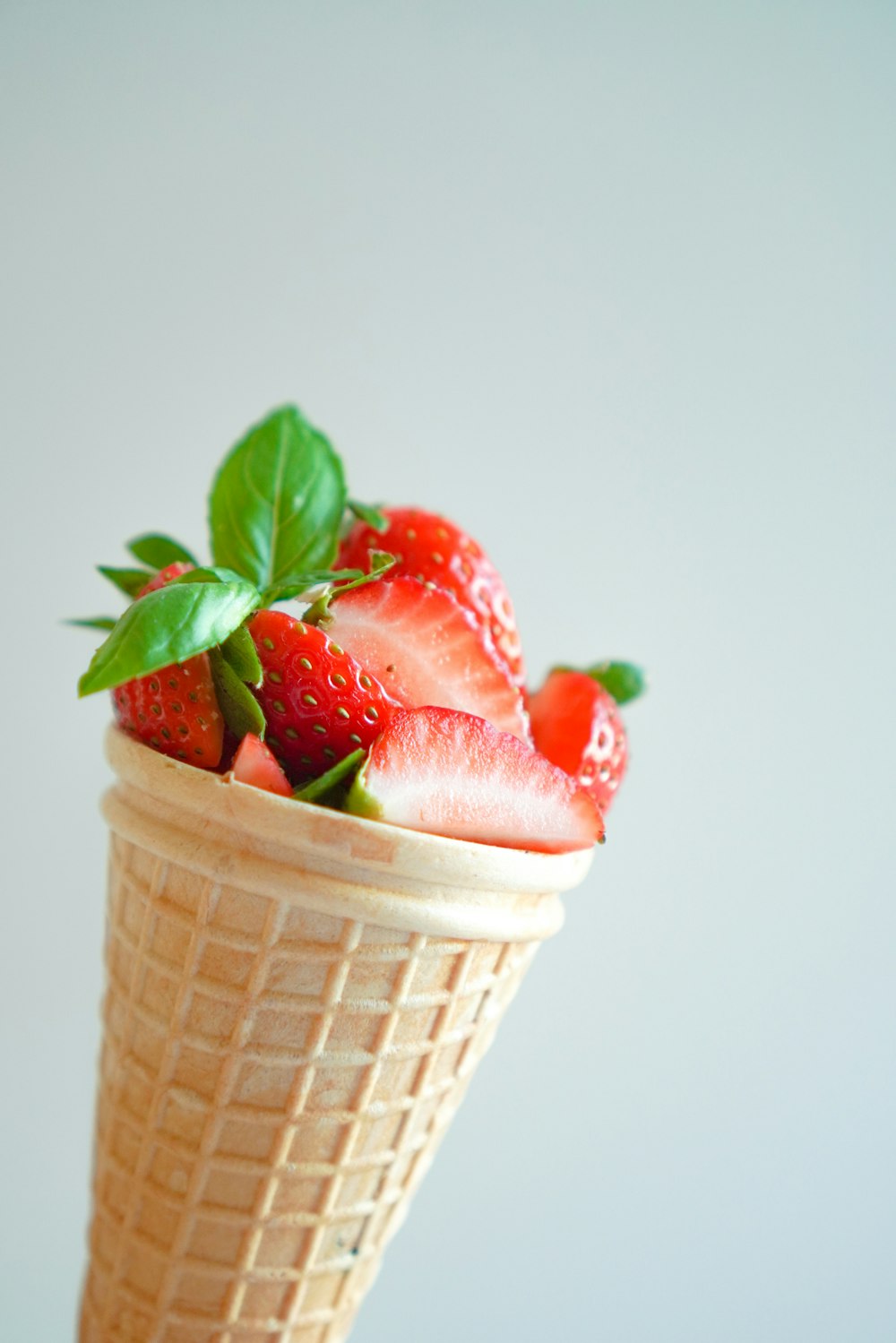 strawberry ice cream in cone