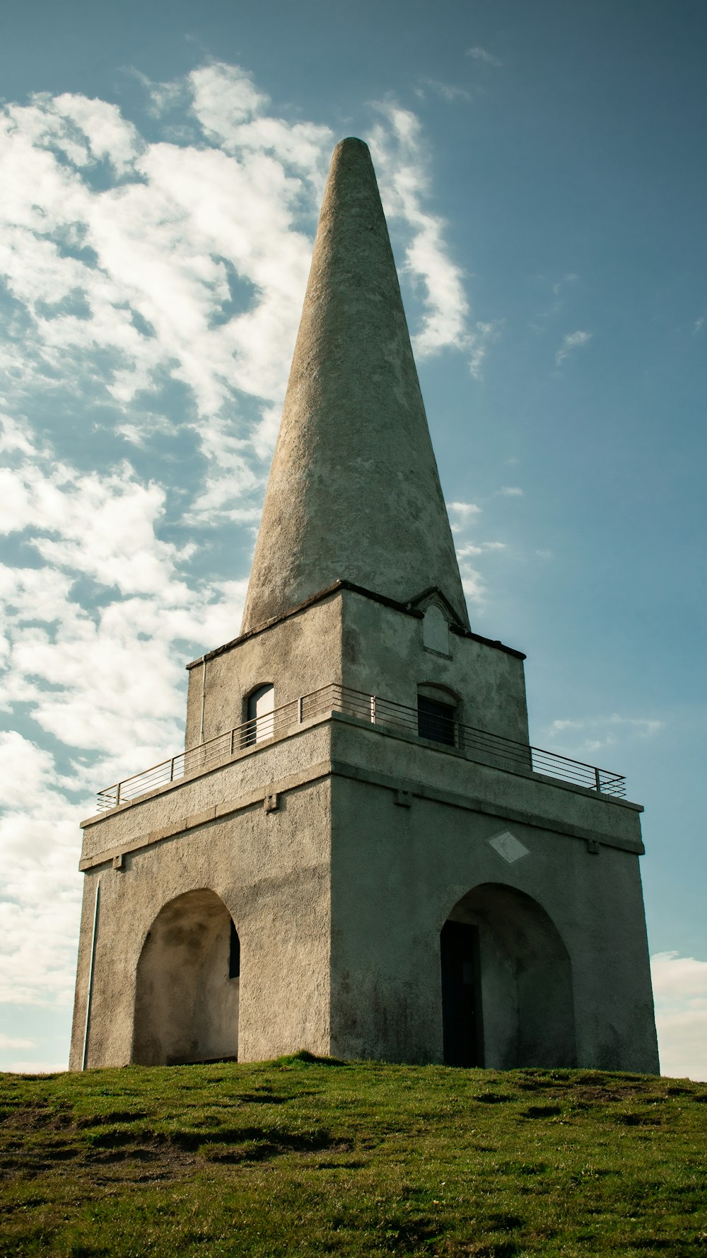 gray concrete tower under blue sky during daytime