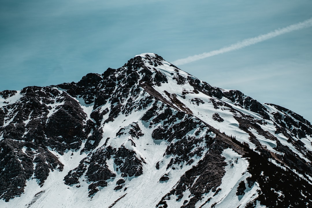 snow covered mountain under blue sky during daytime