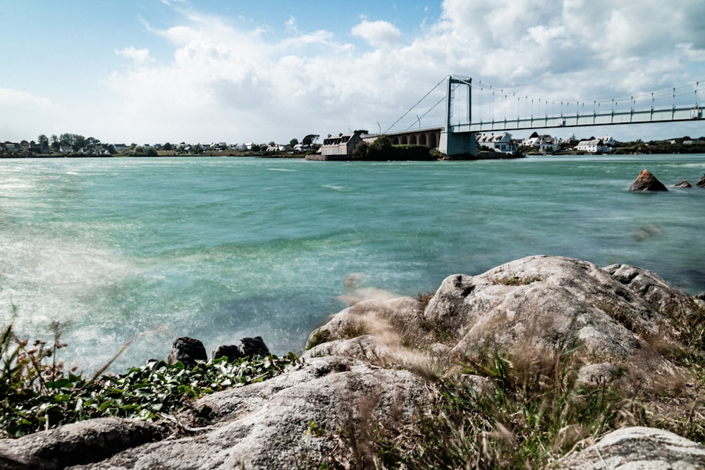 bridge over the sea under blue sky