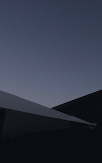 A minimalist architectural shot highlighting clean lines and shadows at dusk.