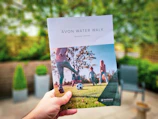 Community members at a local event handing out pet care brochures.