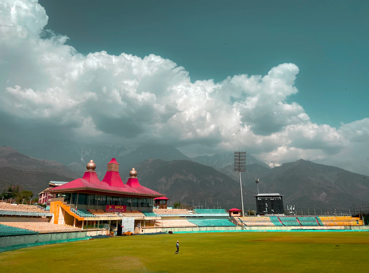 Cricket ground surrounded by hills