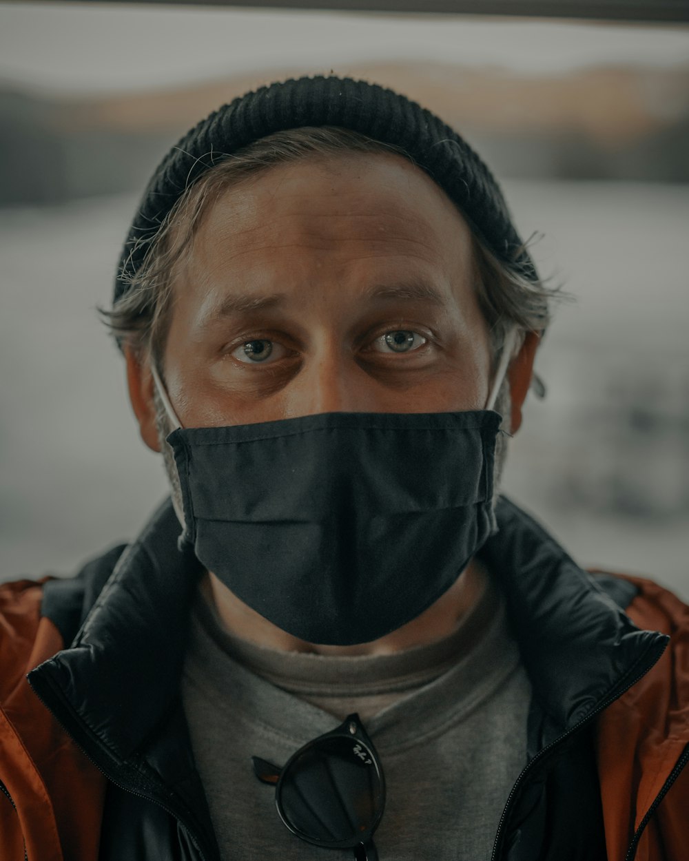 man in black leather jacket wearing black mask