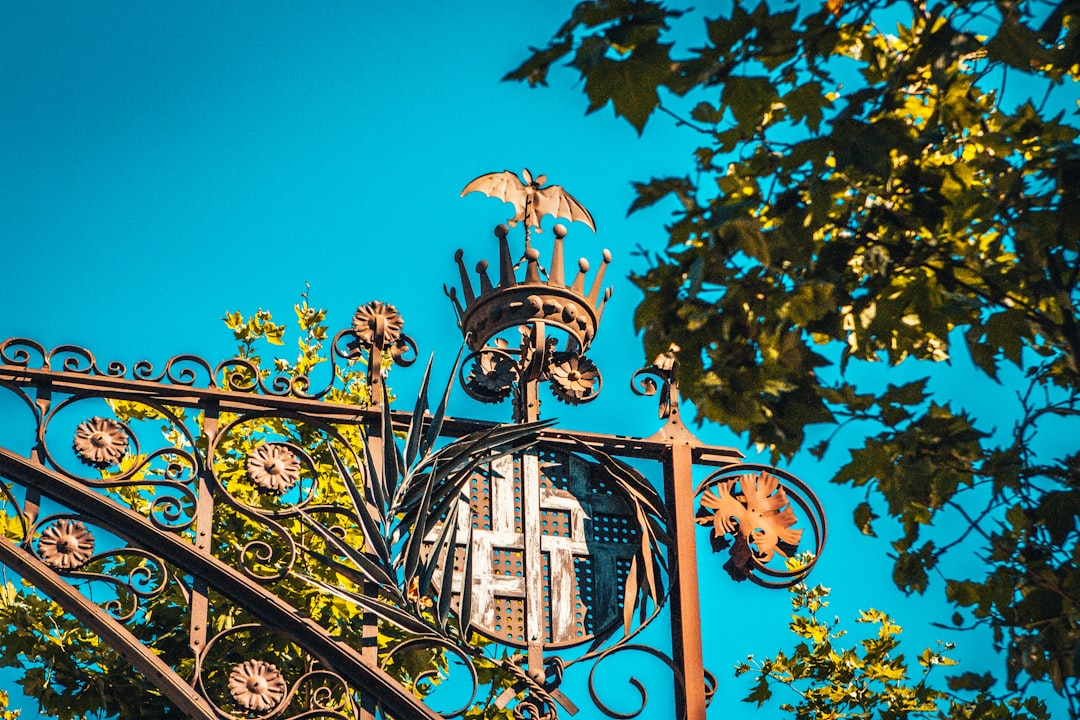 black metal gate with blue and white floral arch