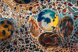 Close-up of a vibrant mosaic artwork with intricate patterns and rich colors