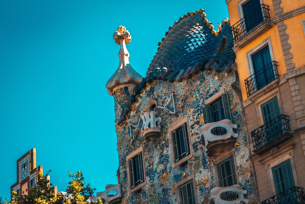 blue and white concrete building under blue sky during daytime