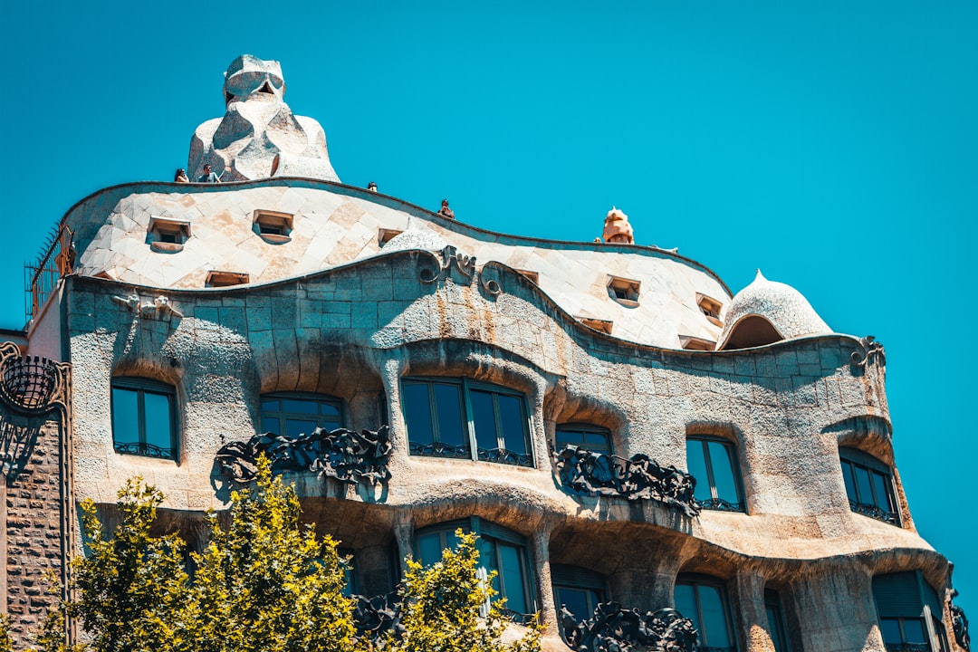 white and blue concrete building under blue sky during daytime