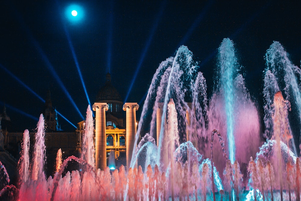 water fountain with lights during night time