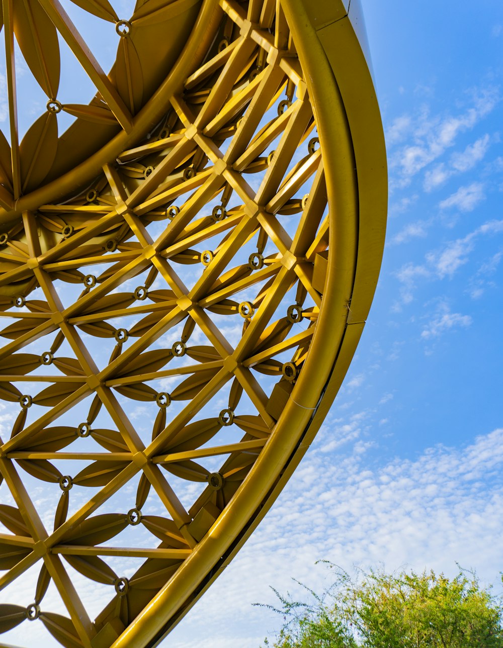 brown metal round frame under blue sky during daytime