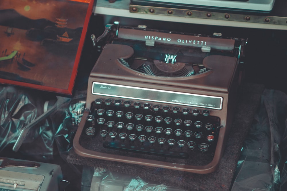 black and white typewriter on brown wooden table