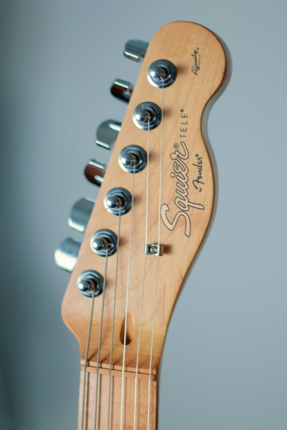 brown and white guitar headstock