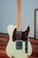 white and brown stratocaster electric guitar