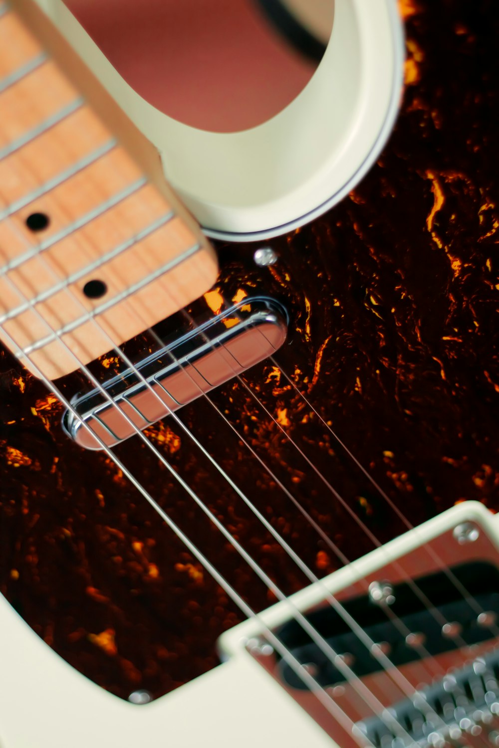 white and black electric guitar