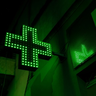 green and white x sign