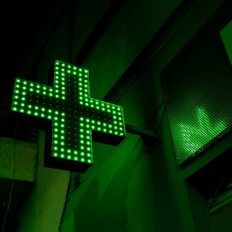 green and white x sign