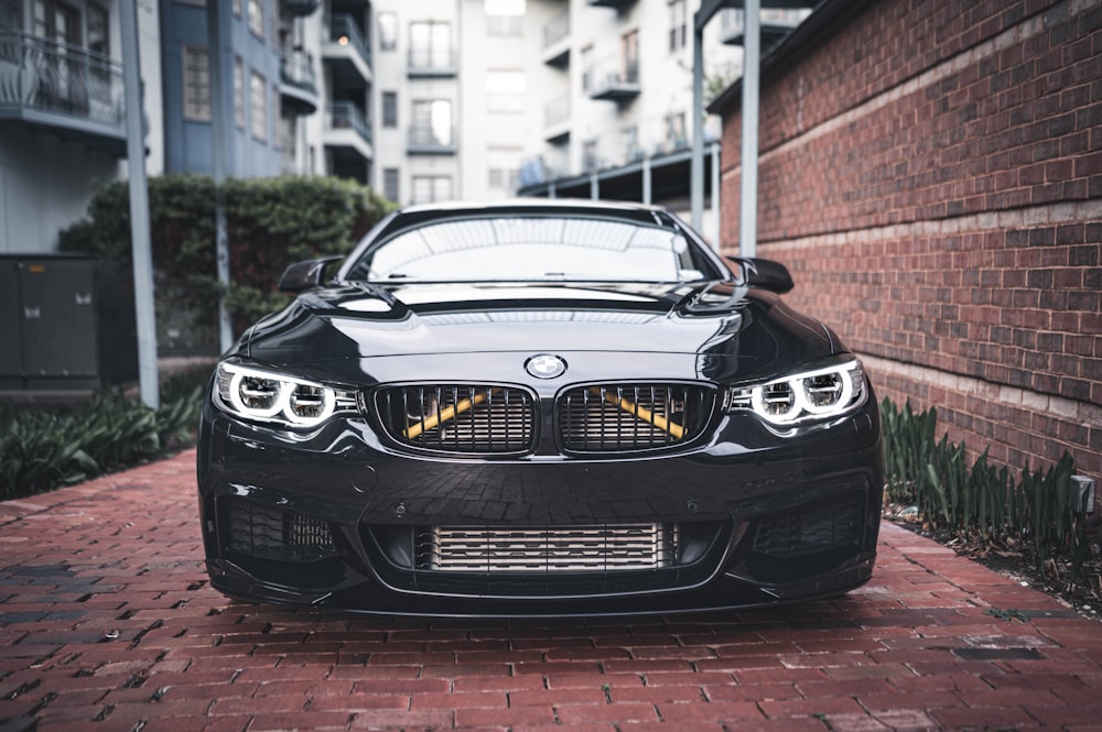 black bmw m 3 parked on street during daytime