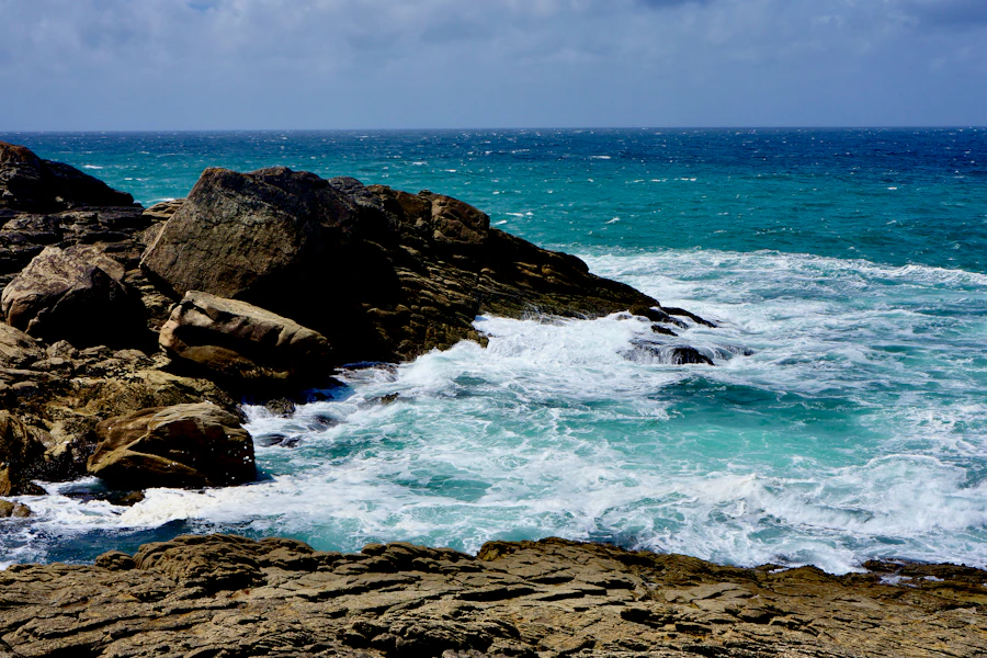Waves crashing on rocky shore in Brittany