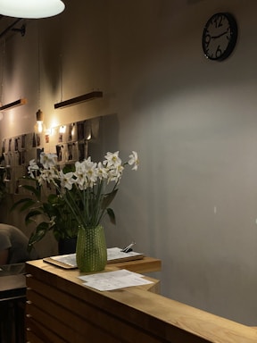 A cozy corner of the boutique with a phone and a notepad ready for customer messages.