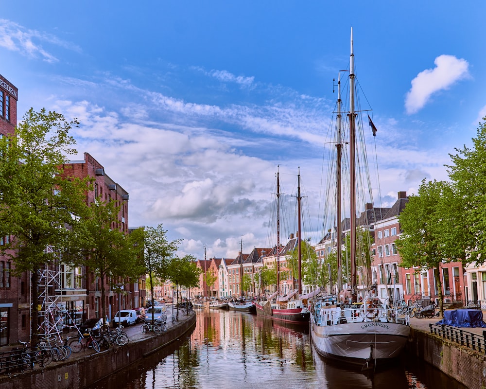 white boat on river near buildings during daytime