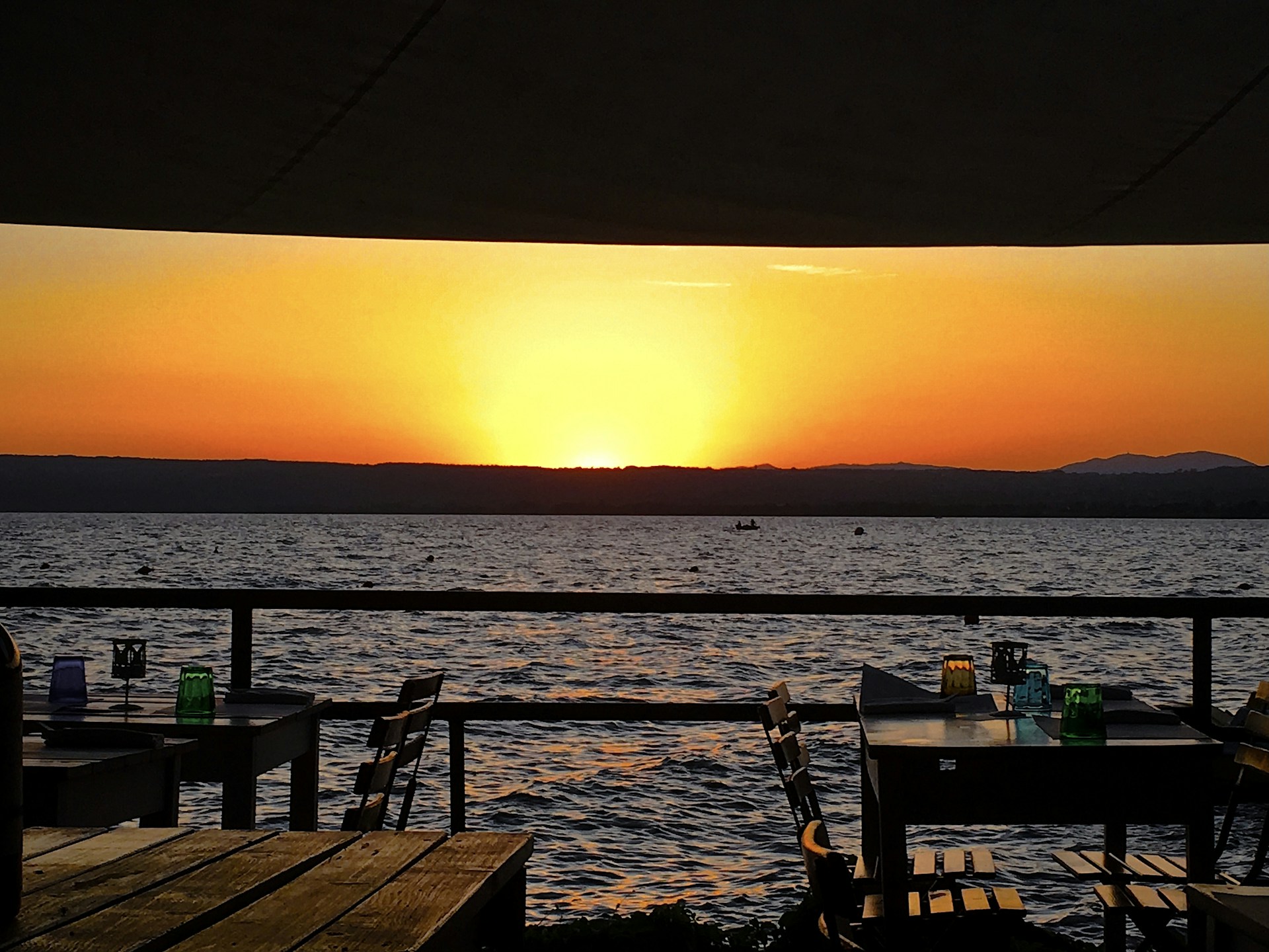 woman wearing yellow long-sleeved dress under white clouds and blue sky during daytime
