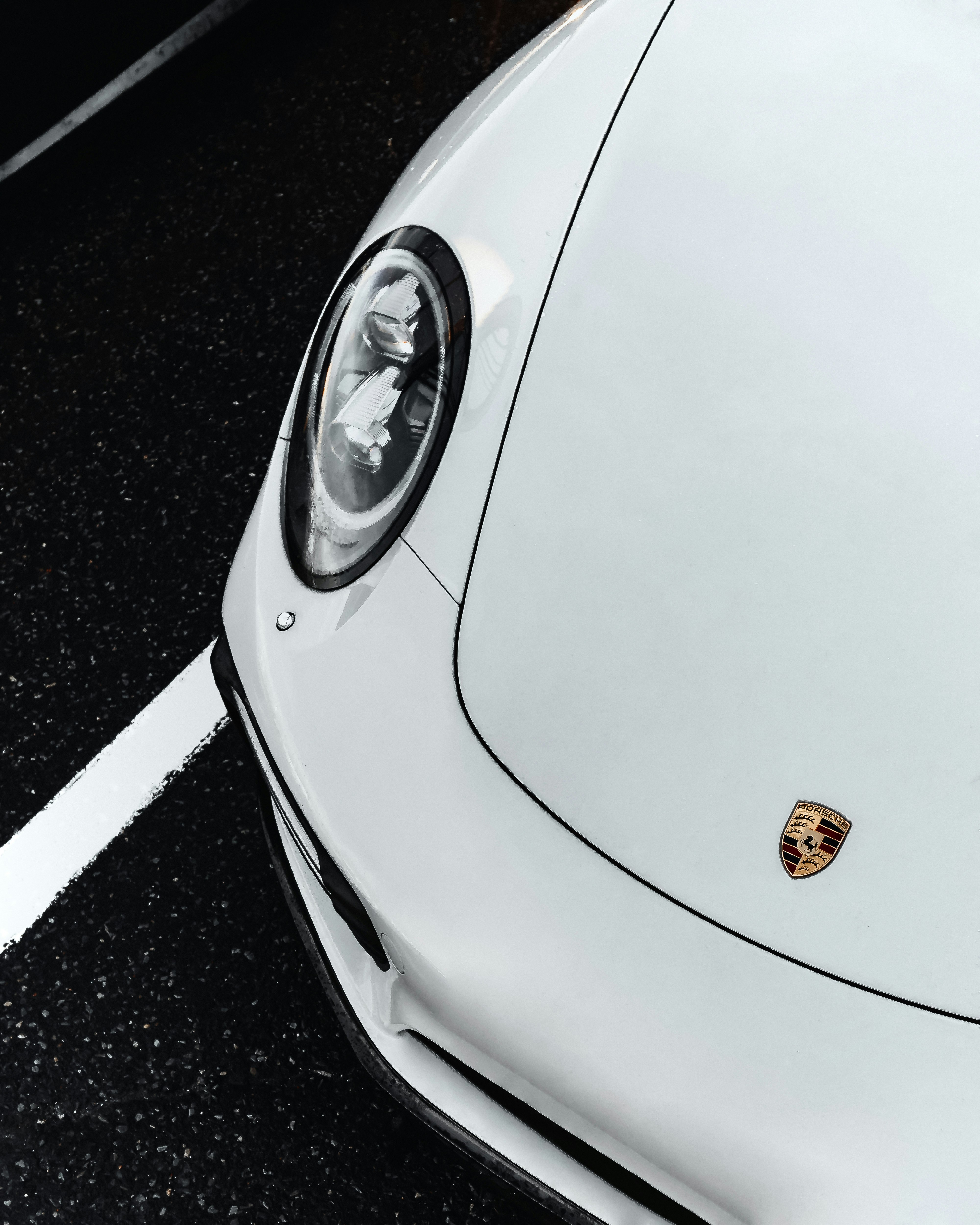 white car on black asphalt road