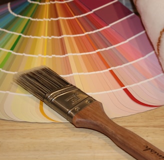 brown paint brush on paint colour wheel