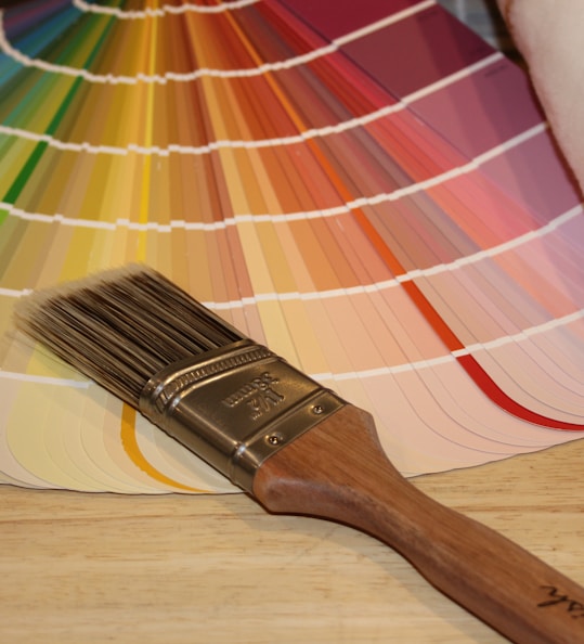 brown paint brush on white and red plaid textile