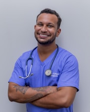 doctor in blue with beard