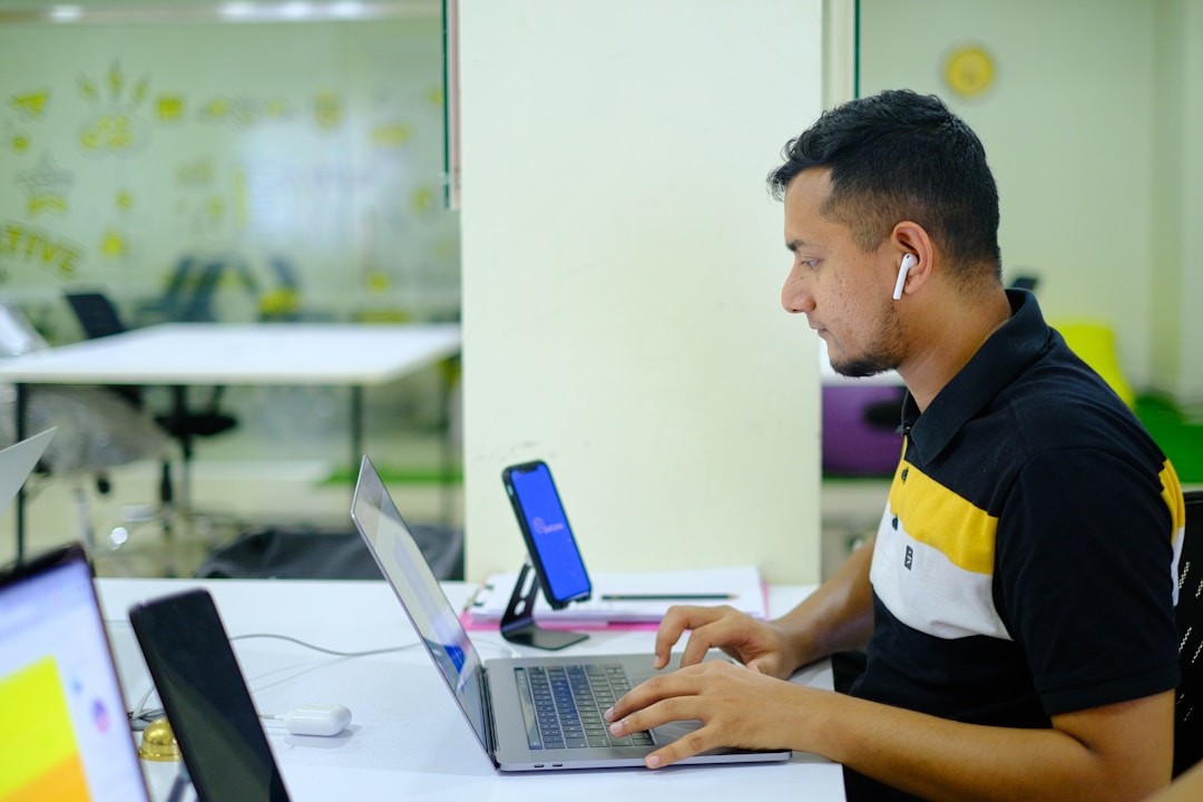 An individual working on integrating email-to-fax software with existing business systems for seamless communication