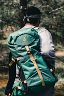 man in gray and green jacket wearing black helmet