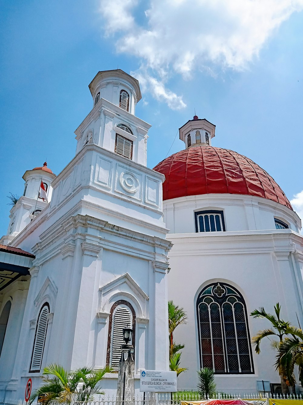 white and red concrete building under blue sky during daytime