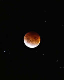 brown moon on black background