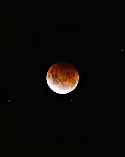 brown moon on black background