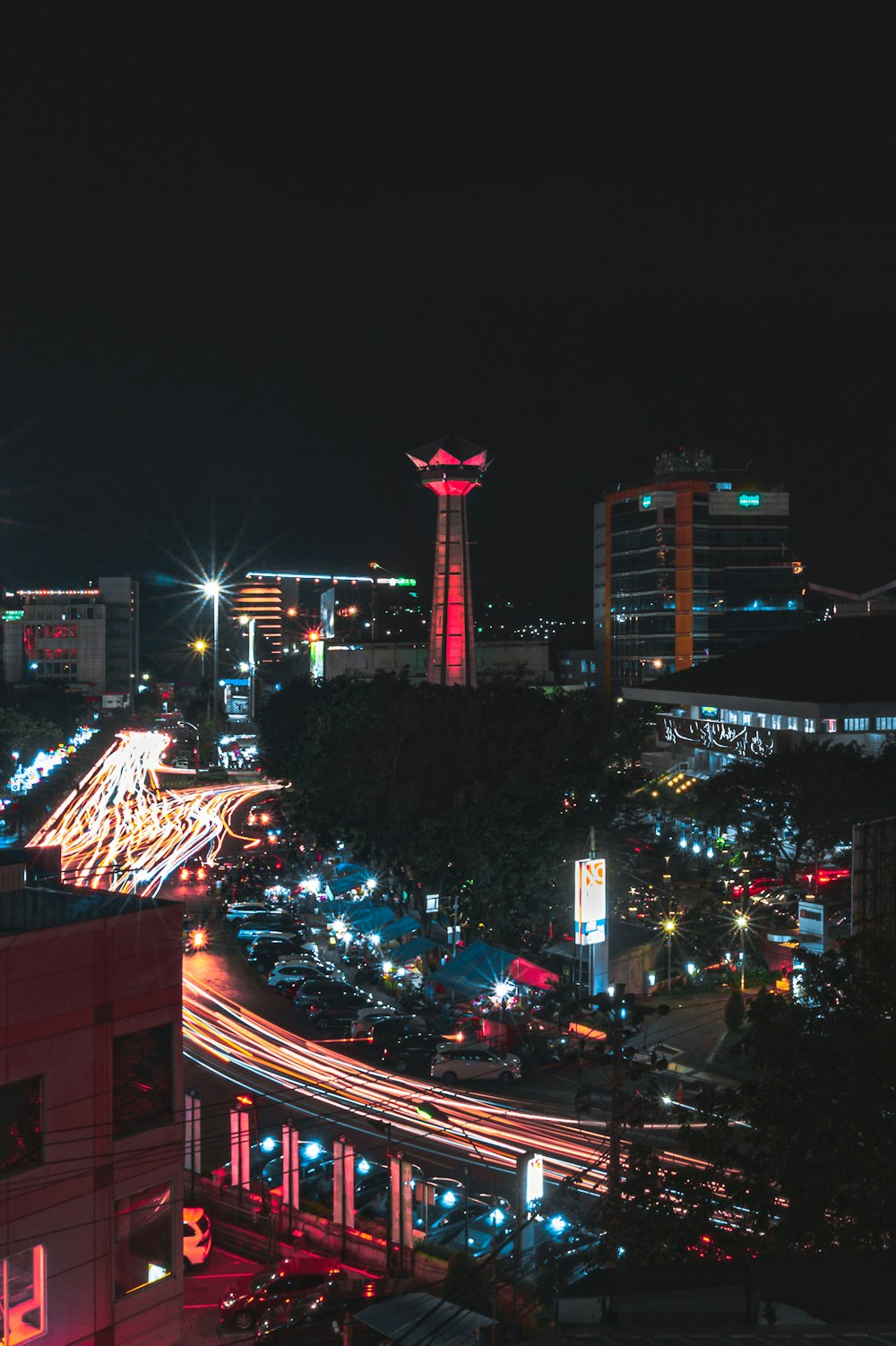 city with high rise buildings during night time